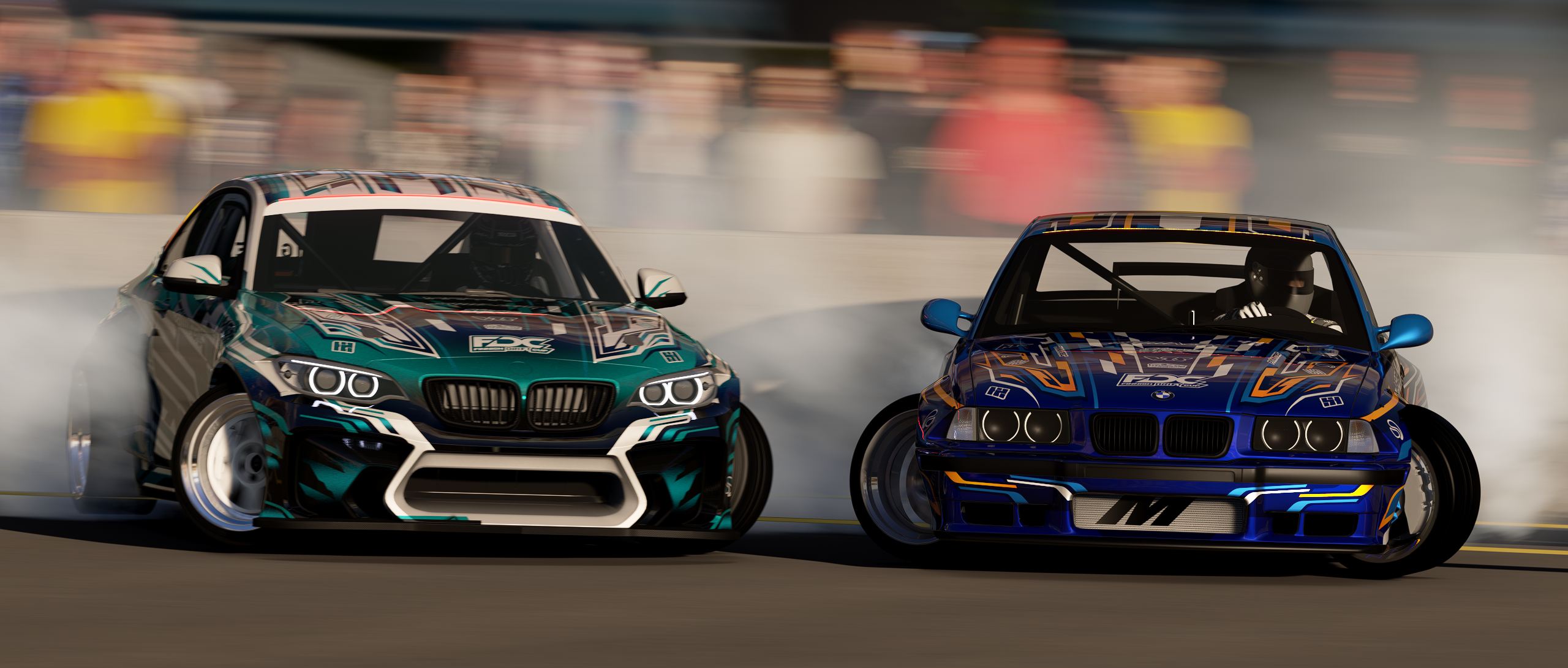 Two Finnreactor cars sliding side by side towards the camera in front of a crowd